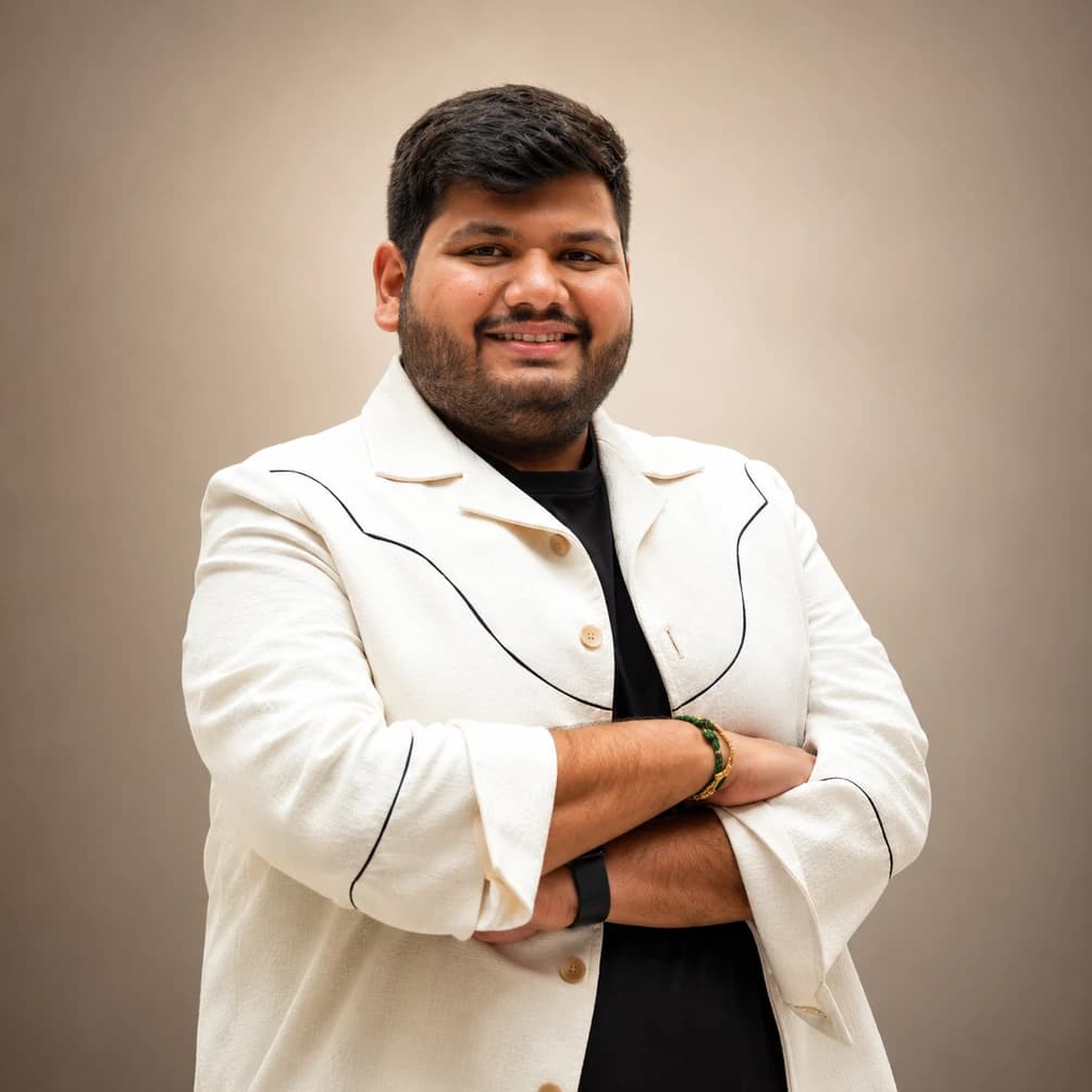 Founder Vinayak Agarwal portrait in tailored white studio jacket